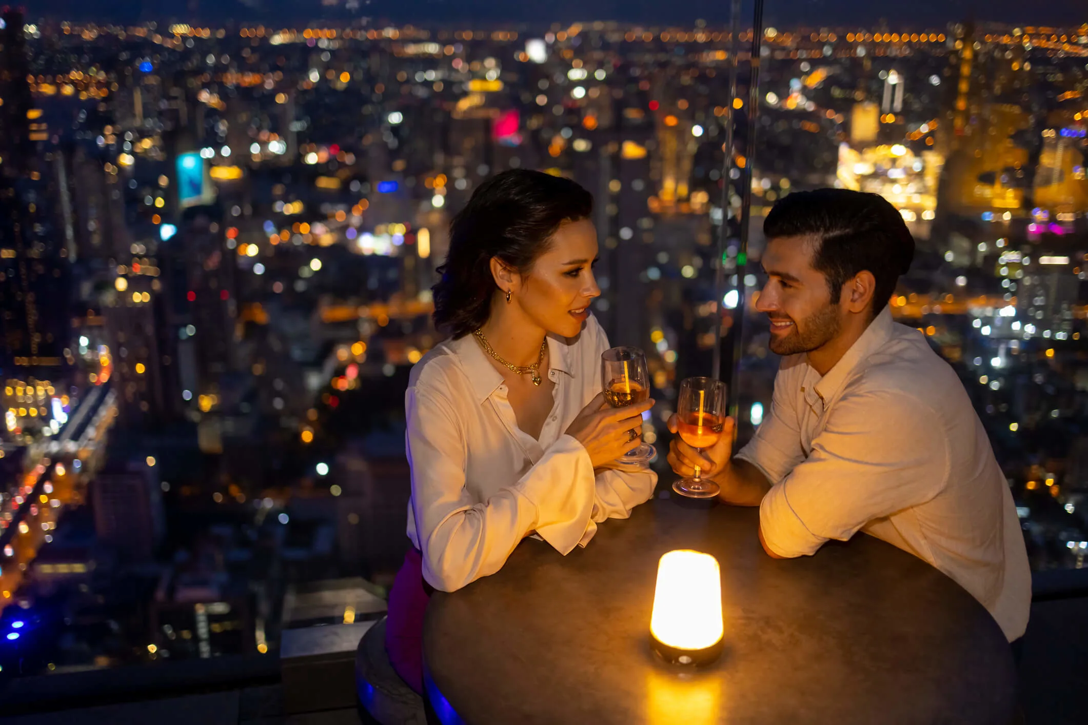 High-End Rooftop Date Overlooking the City Skyline